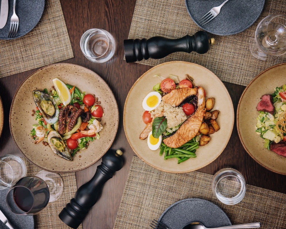An overhead still life of plates on linen.